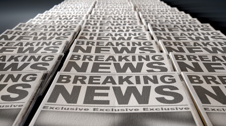 36164776 - a long row of folded newspapers at the end of a press run with a generic headline that reads breaking news on the front page on an isolated white background
